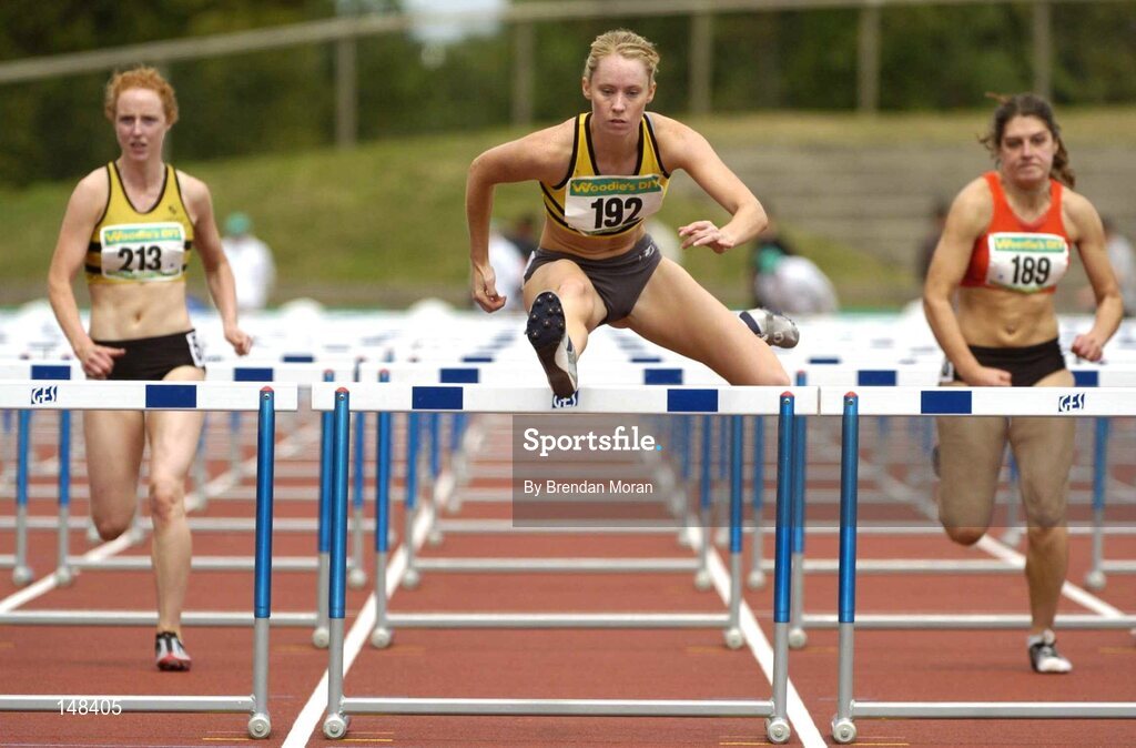 25 July 2004; Derval O'Rourke, Leevale AC, on her way to victory in the Women's 100m Hurdles Final ahead of second placed Niamh Cremin (213), Leevale AC and third placed Niamh Cummins (189), Kilkenny City Harriers AC. AAI Senior Track and Field Championships, Morton Stadium, Santry, Dublin. Picture credit; Brendan Moran / SPORTSFILE