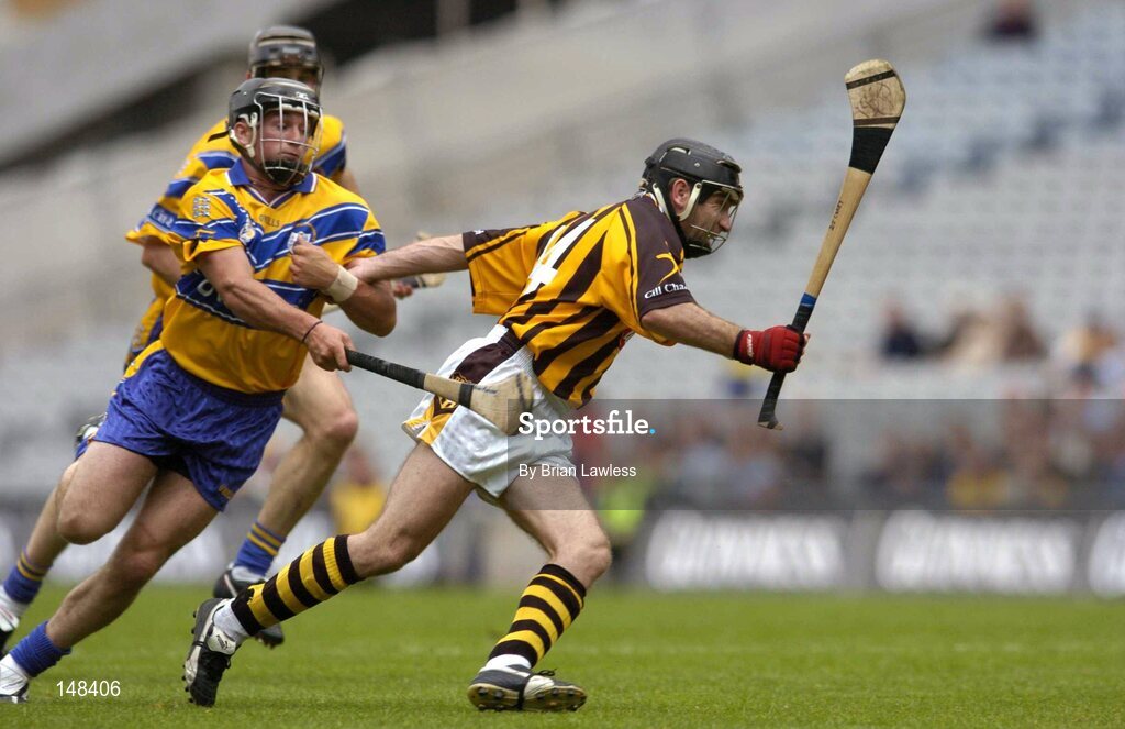 25 July 2004; D.J. Carey, Kilkenny, is tackled by Clare's Alan Markham. Guinness All-Ireland Senior Hurling Championship, Quarter Final, Clare v Kilkenny, Croke Park, Dublin. Picture credit; Brian Lawless / SPORTSFILE