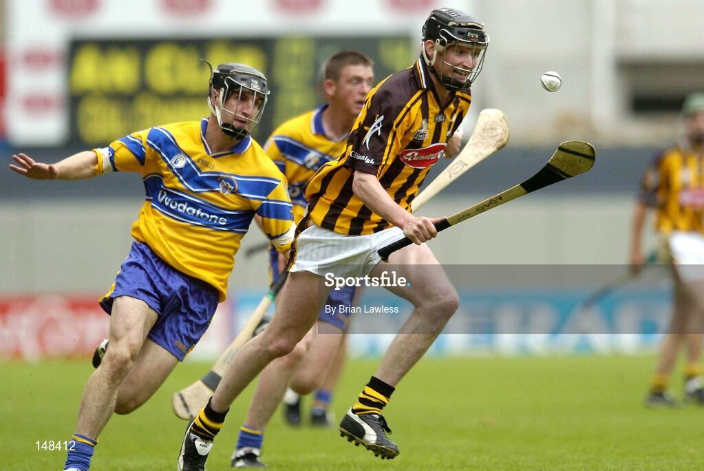 25 July 2004; Martin Comerford, Kilkenny, is tackled by Clare's Gerry Quinn. Guinness All-Ireland Senior Hurling Championship, Quarter Final, Clare v Kilkenny, Croke Park, Dublin. Picture credit; Brian Lawless / SPORTSFILE