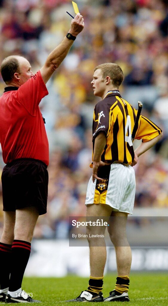 25 July 2004; Kilkenny's Tommy Walsh is issued with his second yellow card by referee Ger Harrington before being sent off. Guinness All-Ireland Senior Hurling Championship, Quarter Final, Clare v Kilkenny, Croke Park, Dublin. Picture credit; Brian Lawless / SPORTSFILE