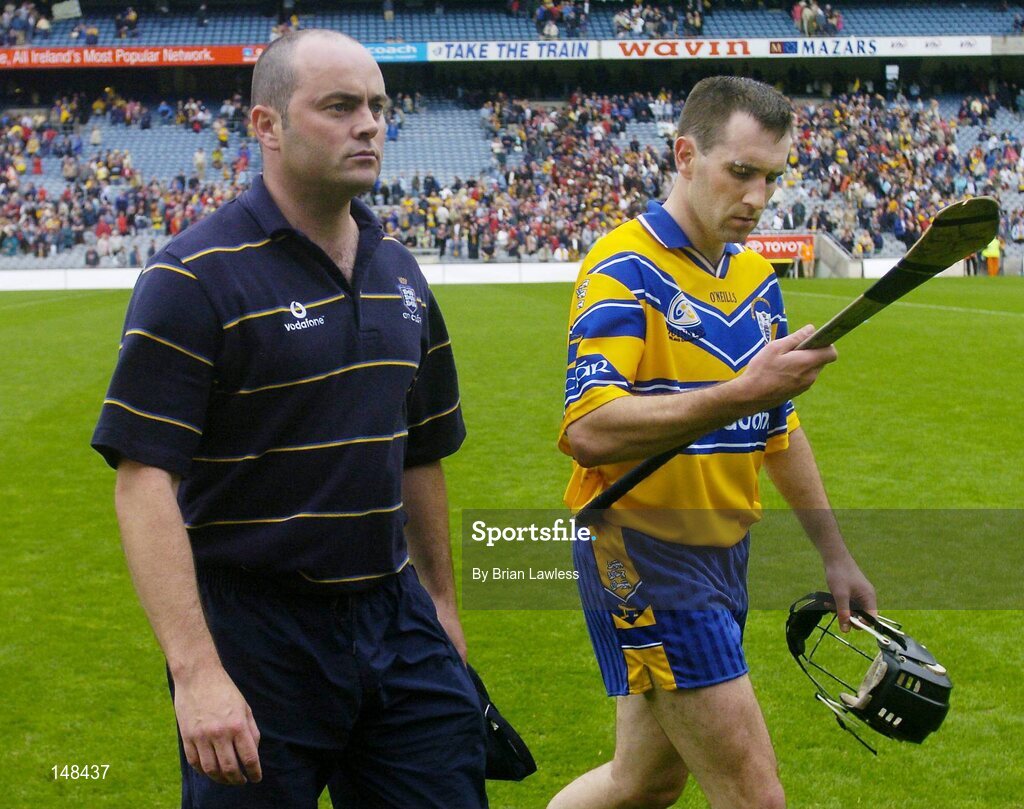 25 July 2004; Clare manager Anthony Daly and his captain Sean McMahon make their way off the pitch after it was confirmed there would be no extra-time. Guinness All-Ireland Senior Hurling Championship, Quarter Final, Clare v Kilkenny, Croke Park, Dublin. Picture credit; Brian Lawless / SPORTSFILE