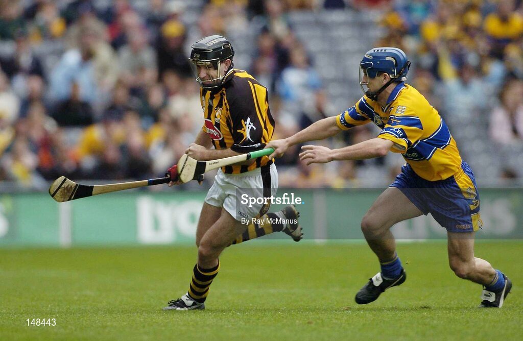 25 July 2004; DJ Carey, Kilkenny, is tackled by Clare's Gerry O'Grady. Guinness All-Ireland Senior Hurling Championship, Quarter Final, Clare v Kilkenny, Croke Park, Dublin. Picture credit; Ray McManus / SPORTSFILE