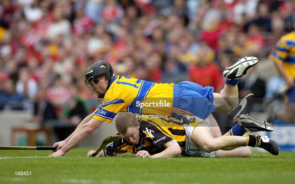 25 July 2004; Tommy Walsh, Kilkenny, is tackled by Clare's Niall Gilligan. Guinness All-Ireland Senior Hurling Championship, Quarter Final, Clare v Kilkenny, Croke Park, Dublin. Picture credit; Ray McManus / SPORTSFILE