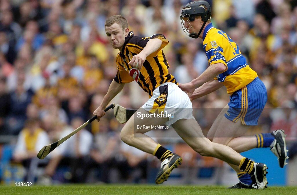 25 July 2004; Tommy Walsh, Kilkenny, is tackled by Clare's Niall Gilligan. Guinness All-Ireland Senior Hurling Championship, Quarter Final, Clare v Kilkenny, Croke Park, Dublin. Picture credit; Ray McManus / SPORTSFILE