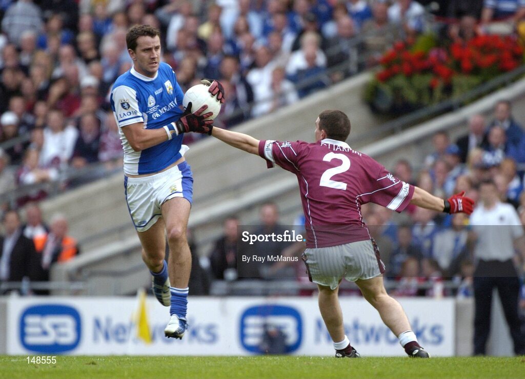 24 July 2004; Kevin Fitzpatrick, Laois, is tackled by Westmeath's James Davitt. Bank of Ireland Leinster Senior Football Championship Final Replay, Westmeath v Laois, Croke Park, Dublin. Picture credit; Ray McManus / SPORTSFILE