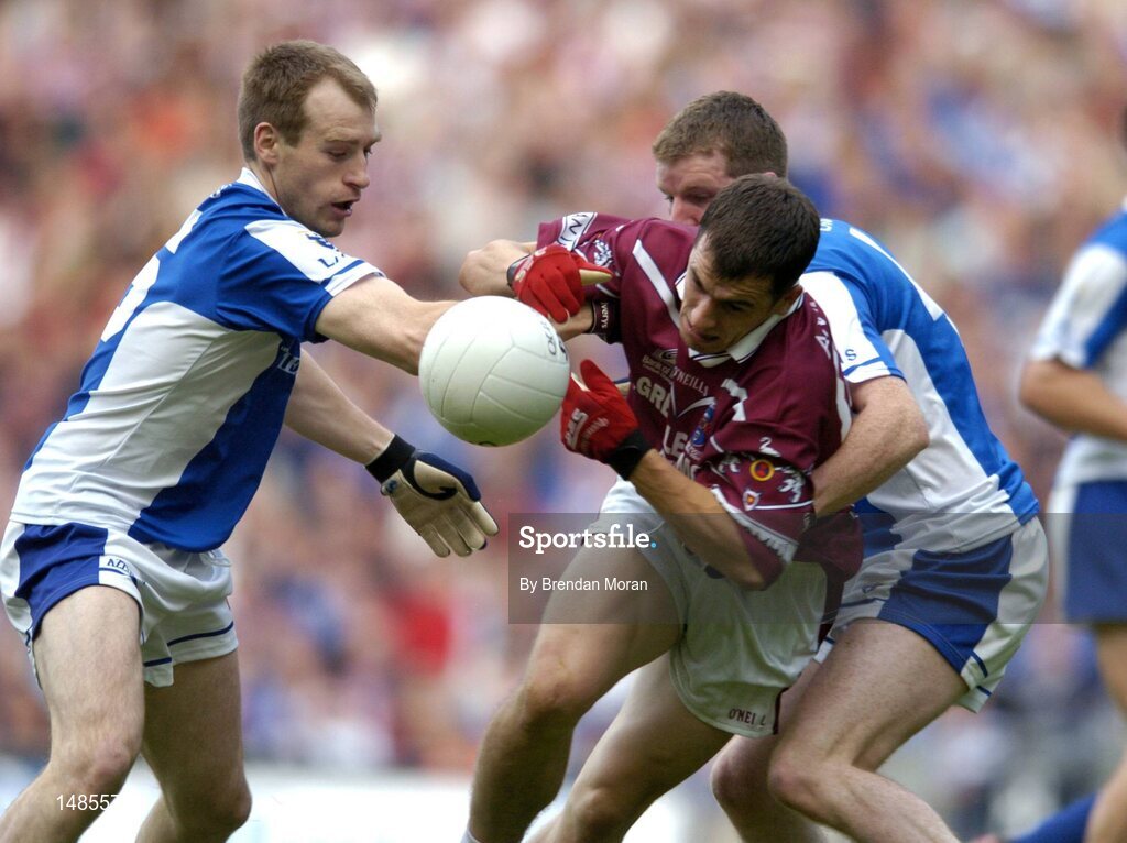 24 July 2004; Patrick Conway, left, and Paul McDonald, Laois, dispossess Dessie Dolan, Westmeath. Bank of Ireland Leinster Senior Football Championship Final Replay, Westmeath v Laois, Croke Park, Dublin. Picture credit; Brendan Moran / SPORTSFILE