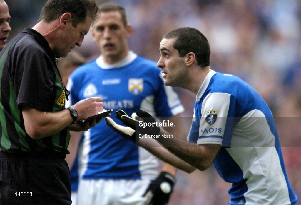 24 July 2004; Aidan Fennelly, Laois, protests his innocence before being shown a yellow card by referee Michael Monahan. Bank of Ireland Leinster Senior Football Championship Final Replay, Westmeath v Laois, Croke Park, Dublin. Picture credit; Brendan Moran / SPORTSFILE