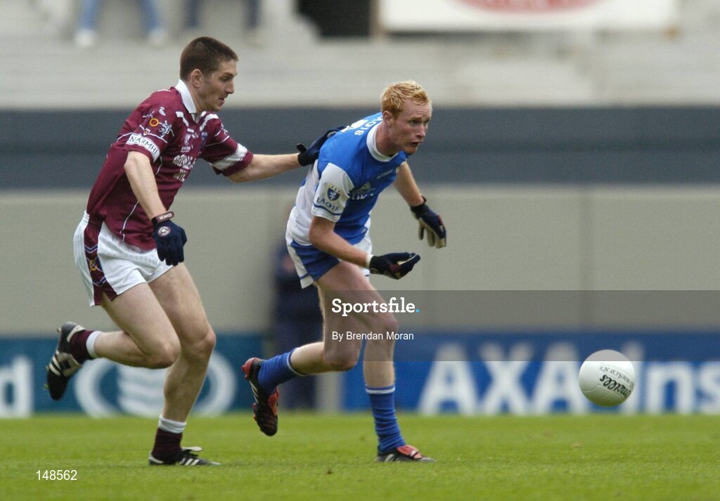 24 July 2004; Pauric Clancy, Laois, in action against David O'Shaughnessy, Westmeath. Bank of Ireland Leinster Senior Football Championship Final Replay, Westmeath v Laois, Croke Park, Dublin. Picture credit; Brendan Moran / SPORTSFILE