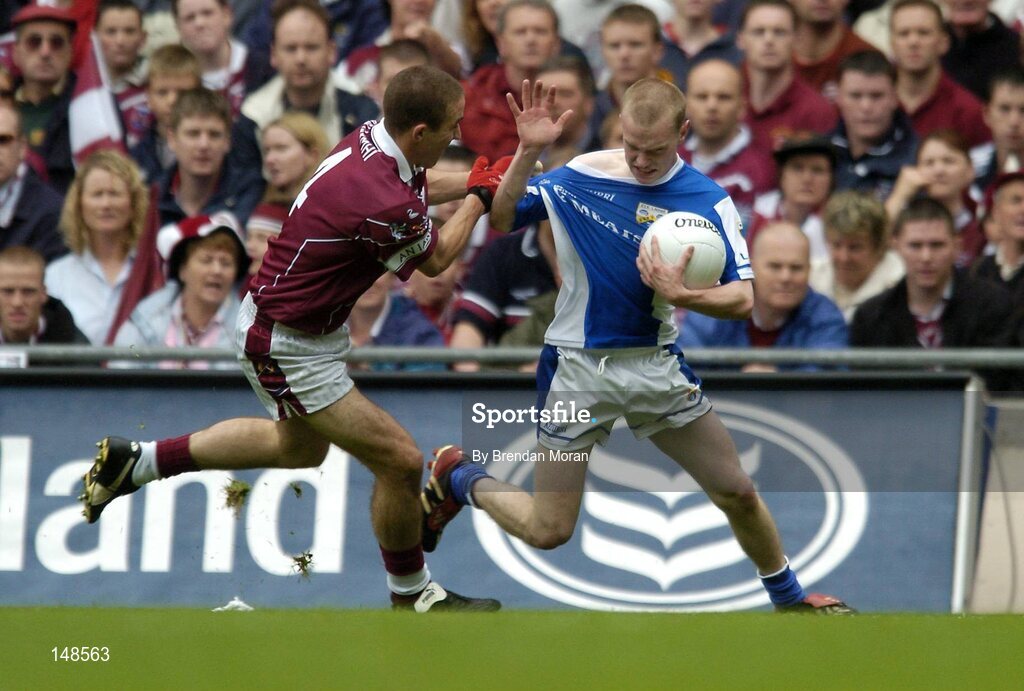 24 July 2004; Donal Brennan, Laois, in action against John Keane, Westmeath. Bank of Ireland Leinster Senior Football Championship Final Replay, Westmeath v Laois, Croke Park, Dublin. Picture credit; Brendan Moran / SPORTSFILE