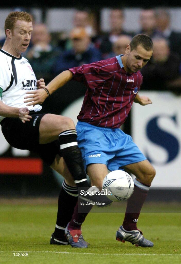 26 July 2004; Declan O'Brien, Drogheda United, in action against Stephen McGuinness, Dundalk. FAI Carlsberg Cup, Second Round Replay, Drogheda United v Dundalk, United Park, Drogheda, Co. Louth. Picture credit; David Maher / SPORTSFILE