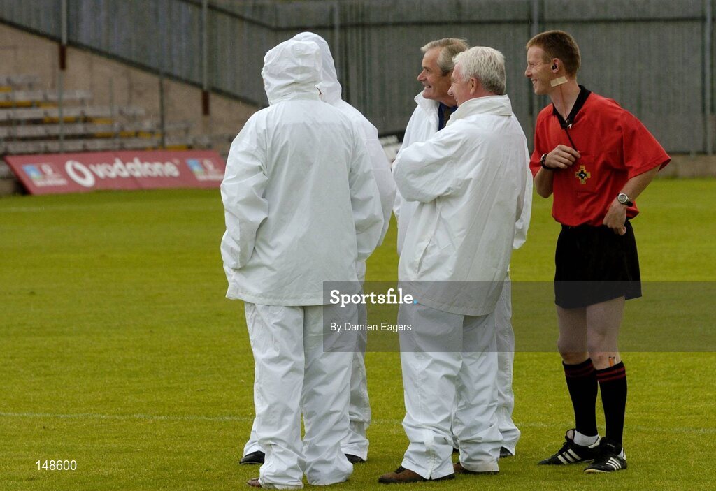 24 July 2004; Referee Joe McQuillan shares a joke with his umpires before the match. Bank of Ireland Senior Football Championship Qualifier, Round 4, Fermanagh v Donegal, Tighernach's Park, Clones. Co. Monaghan. Picture credit; Damien Eagers / SPORTSFILE
