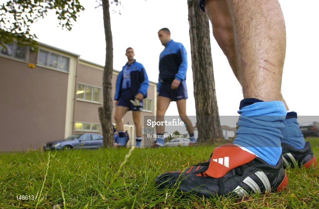 26 July 2004; The Dubs will be relying on the new technology in their adidas Predator Pulse boots to give them the edge over Roscommon, in the next stage of the All-Ireland Football Championship qualifiers on Saturday 31st July at Croke Park. Pictured with the boots prior to a squad training session ahead of next weekend's game are Darren Magee, left, and Paul Casey as they make their way onto the training pitch. Picture credit; Brendan Moran / SPORTSFILE