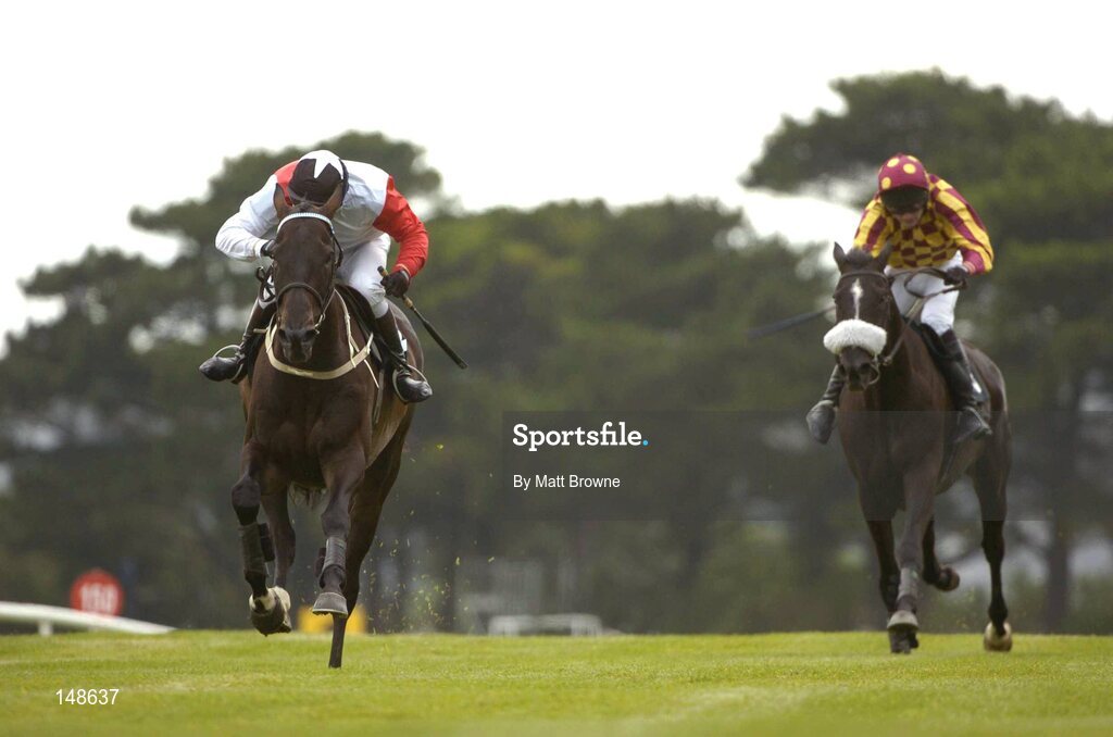 27 July 2004; Talking Cents, with Mick Fitzgerald up, on the way to winning the Albatros Plant Nutrition Steeplechase from second place Ross Moff with Ruby Walsh. Galway Races, Ballybrit, Co. Galway. Picture credit; Matt Browne / SPORTSFILE