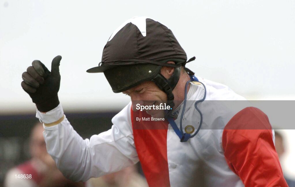27 July 2004; Mick Fitzgerald celebrates after winning the Albatros Plant Nutrition Steeplechase on Talking Cents. Galway Races, Ballybrit, Co. Galway. Picture credit; Matt Browne / SPORTSFILE