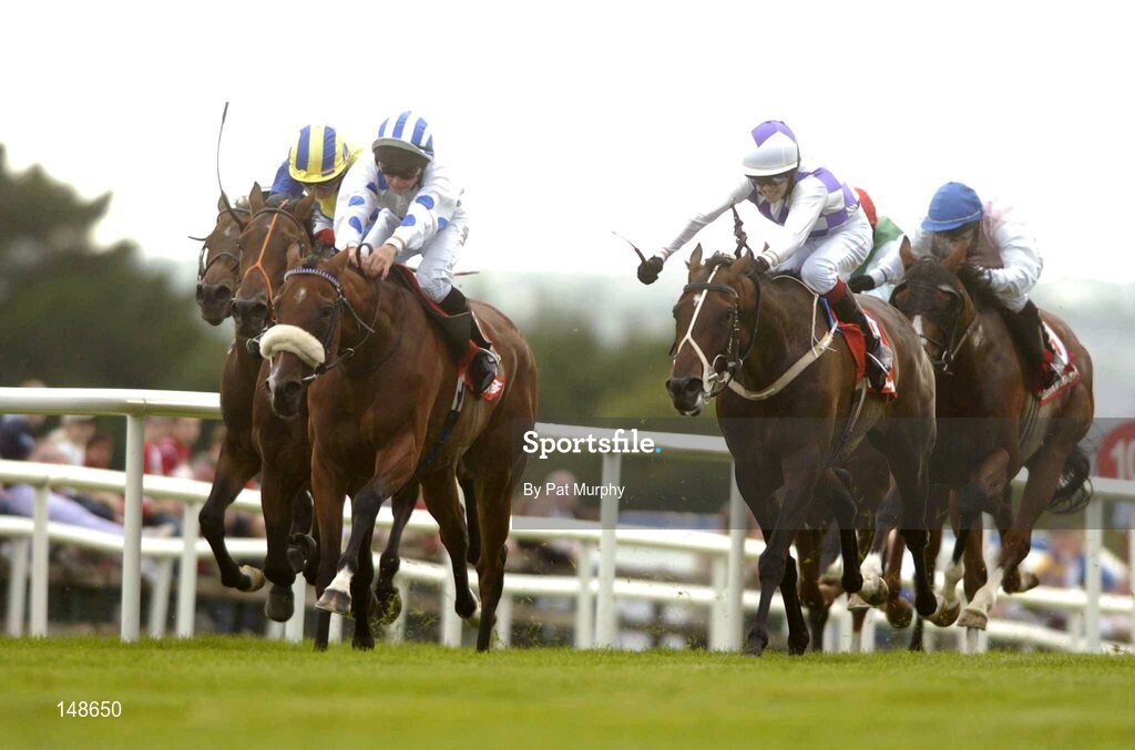 27 July 2004; Palace Star, with Rory Cleary up, blue and white cap, races clear of Amourallis with Peter Beggy up, purple and white cap, and Calorando with Timmy O'Shea, left, yellow and blue cap, on their way to winning the McDonagh EBF Handicap. Galway Races, Ballybrit, Co. Galway. Picture credit; Pat Murphy / SPORTSFILE