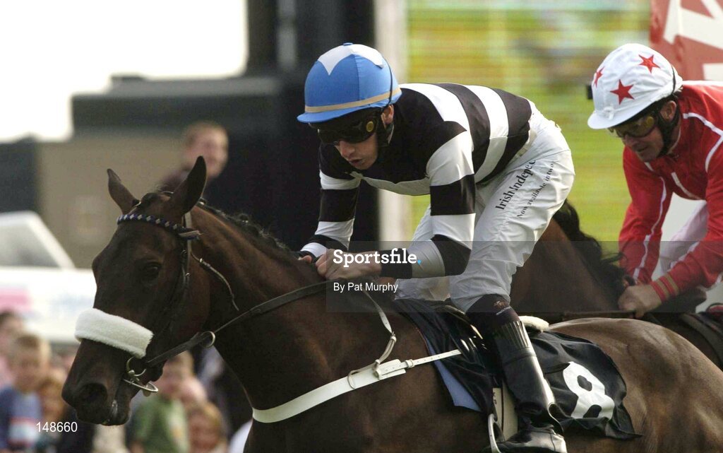 27 July 2004; Right Key, with Declan McDonogh up, crosses the finish line ahead of Faint Heart with Mick Kinane up, back, to win the McDonagh Feeds EBF Fillies Maiden. Galway Races, Ballybrit, Co. Galway. Picture credit; Pat Murphy / SPORTSFILE