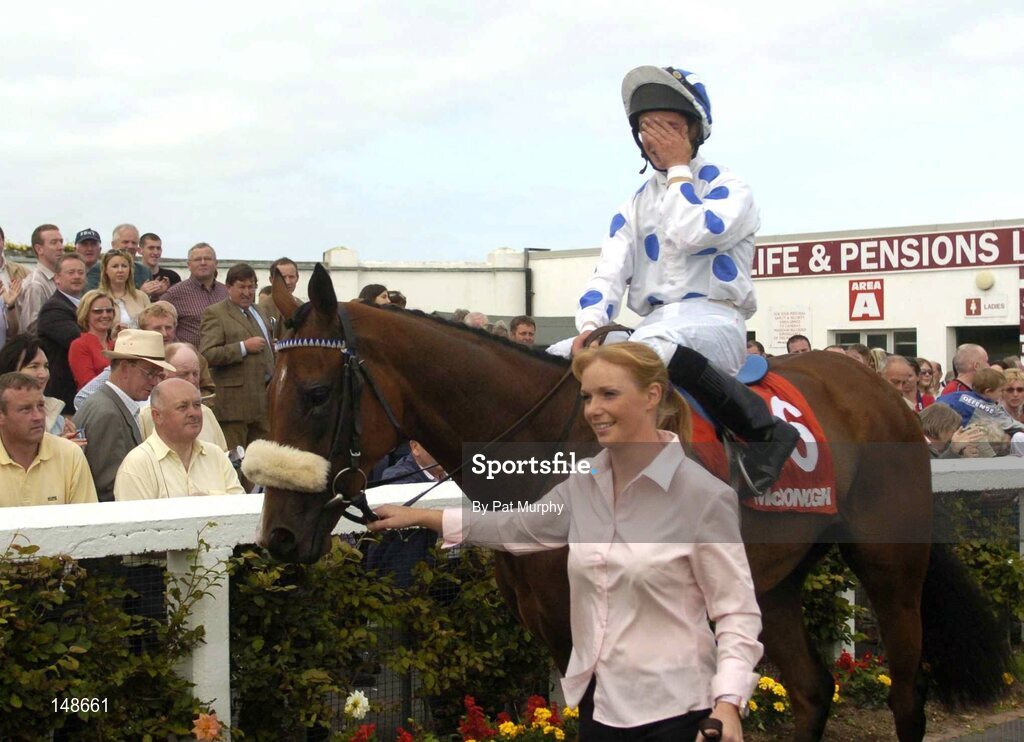27 July 2004; Jockey Rory Cleary shows his emotions while Palace Star is led into the winners enclosure by Jodi Farrelly after winning the McDonagh EBF Handicap. Galway Races, Ballybrit, Co. Galway. Picture credit; Pat Murphy / SPORTSFILE