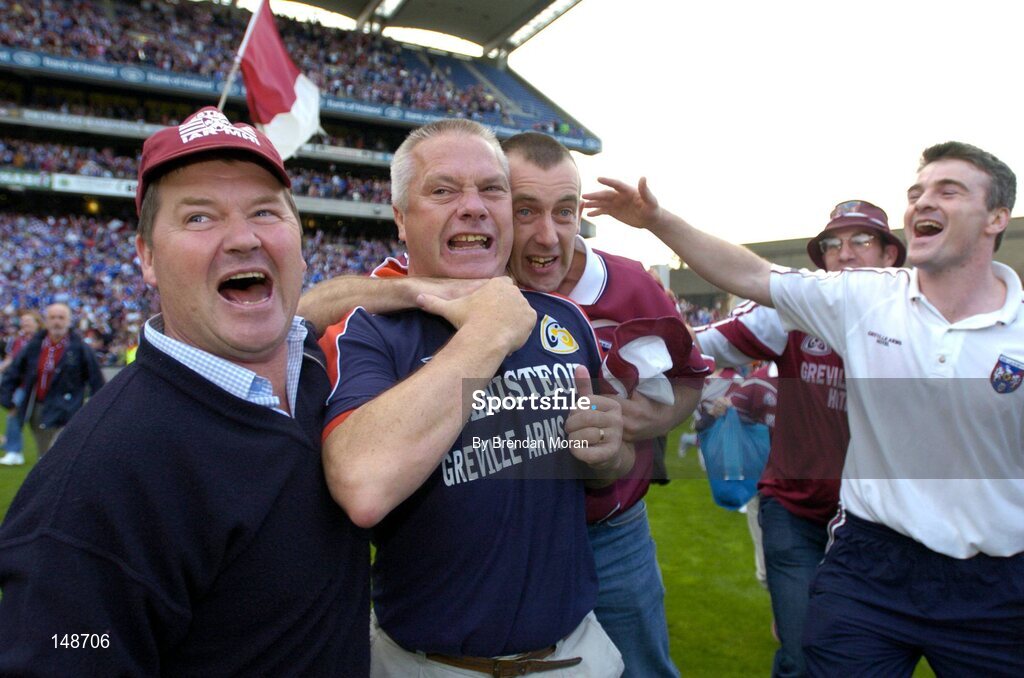 24 July 2004; Westmeath manager Paidi O Se attempts to fight off celebrating fans after victory over Laois. Bank of Ireland Leinster Senior Football Championship Final Replay, Westmeath v Laois, Croke Park, Dublin. Picture credit; Brendan Moran / SPORTSFILE