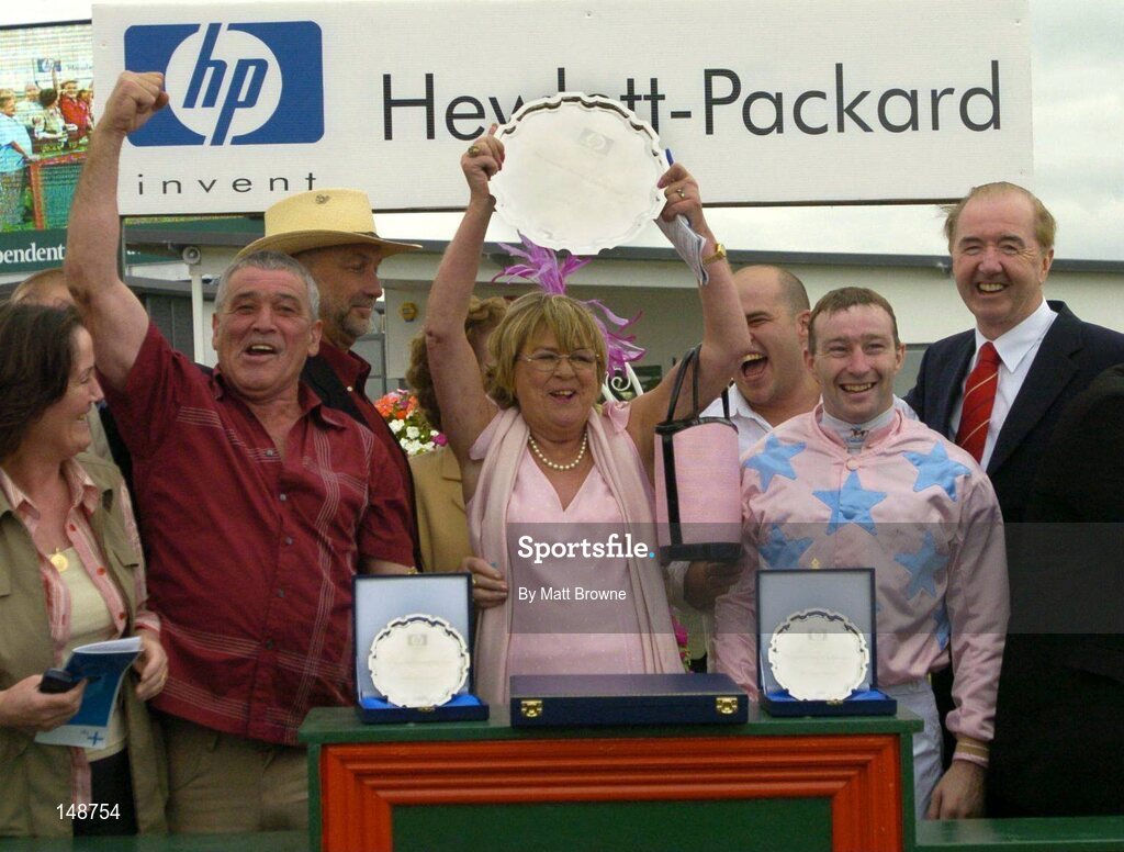 28 July 2004;  Kay Devlin, owner of Ansar, center, and the winning connections calebrate with the Hewlett-Packard Galway Plate. Galway Races, Ballybrit, Co. Galway. Picture credit; Matt Browne / SPORTSFILE