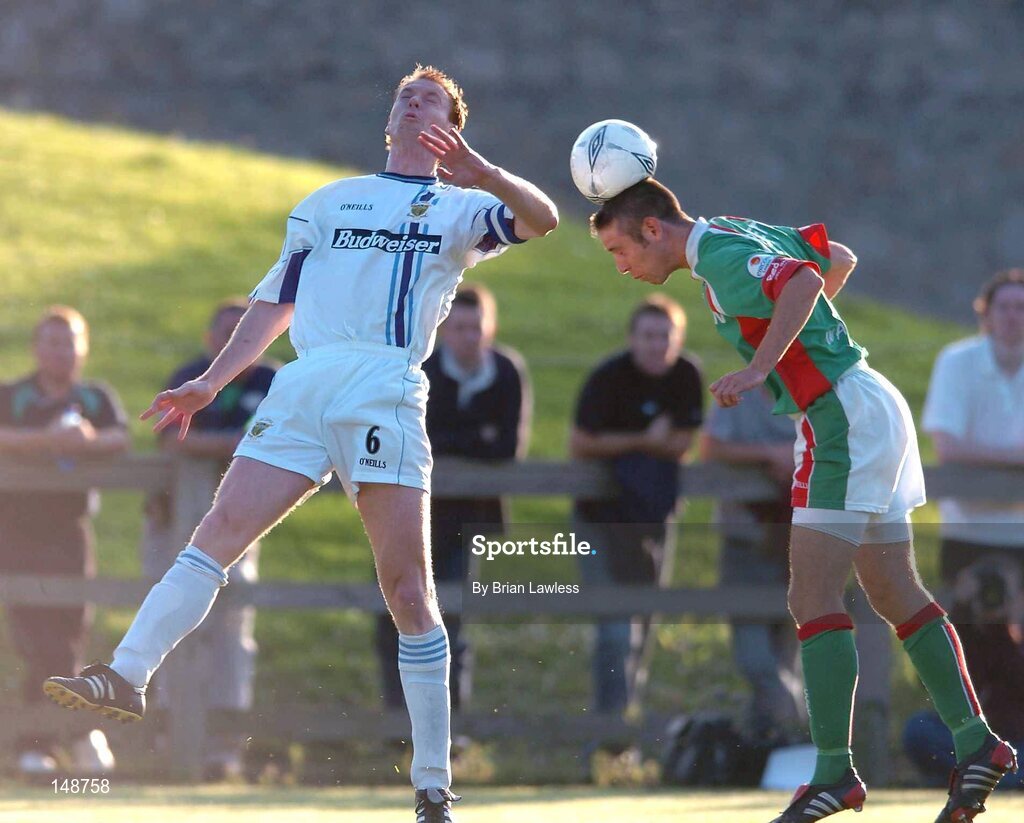 28 July 2004; Alan Bennett, Cork City, in action against Tony McDonnell, UCD. FAI Cup Replay, UCD v Cork City, Belfield Park, UCD, Dublin. Picture credit; Brian Lawless / SPORTSFILE