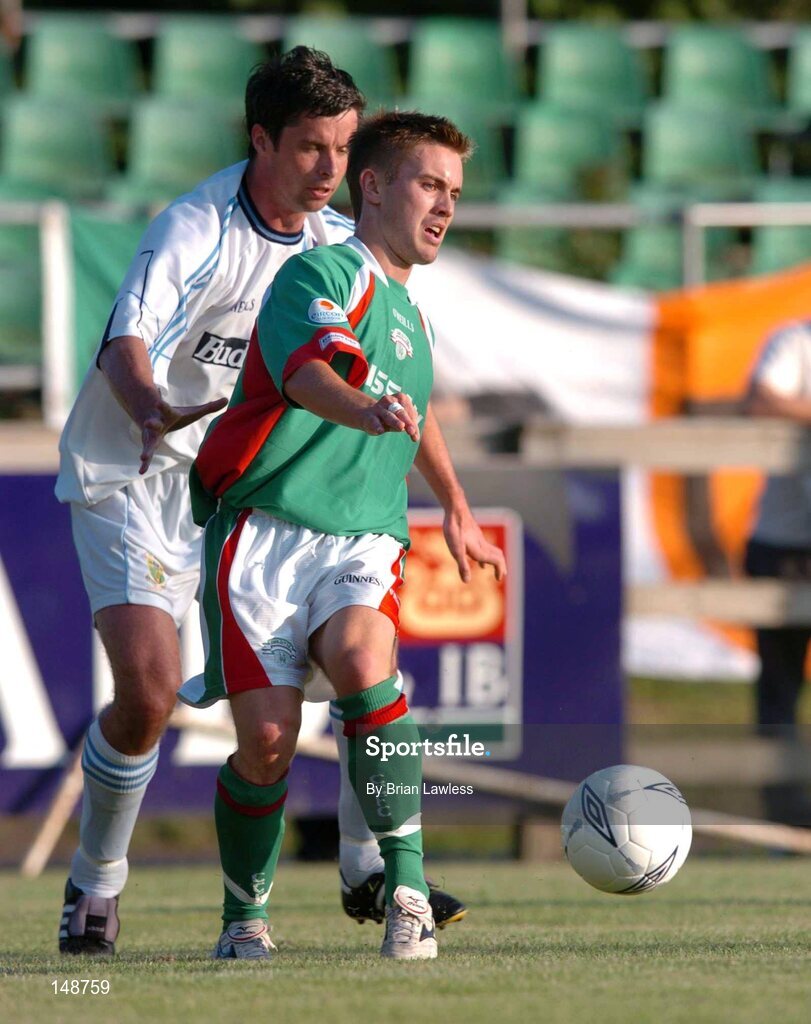 28 July 2004; Liam Kearney, Cork City, in action against Alan Mahon, UCD. FAI Cup Replay, UCD v Cork City, Belfield Park, UCD, Dublin. Picture credit; Brian Lawless / SPORTSFILE