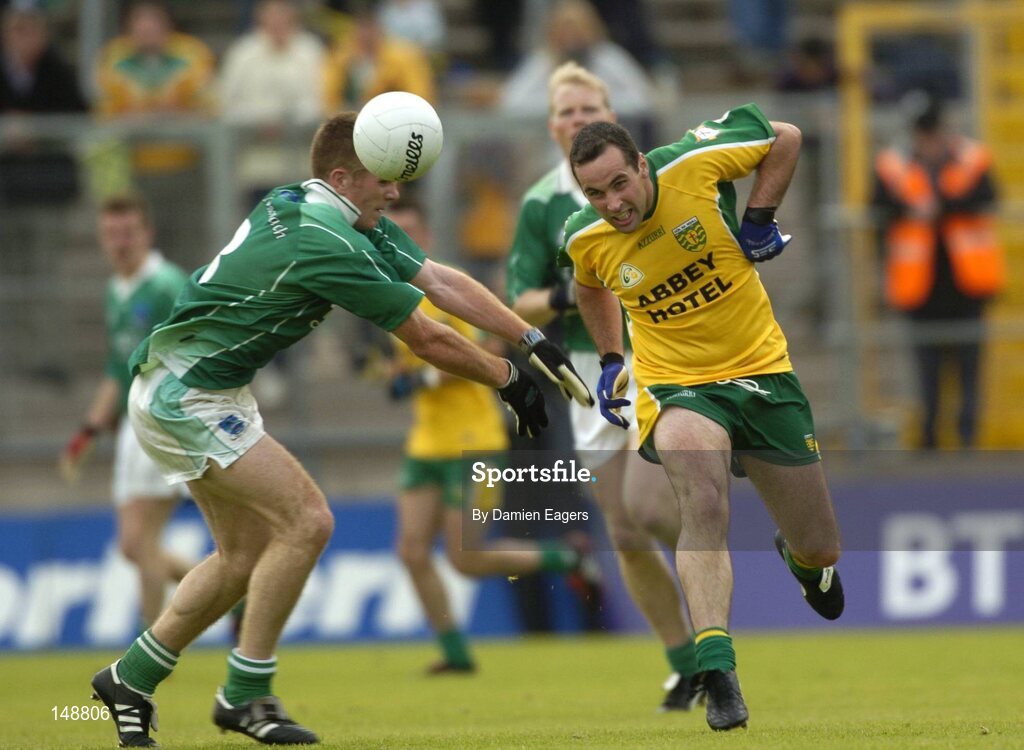 24 July 2004; Shane Carr, Donegal, is tackled by Fermanagh's Martin McGrath. Bank of Ireland Senior Football Championship Qualifier, Round 4, Fermanagh v Donegal, Tighernach's Park, Clones. Co. Monaghan. Picture credit; Damien Eagers / SPORTSFILE