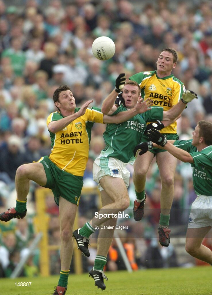 24 July 2004; Donegal pair Christy Toye, left, and Brendan Boyle contest a high ball with Fermanagh's Martin McGrath. Bank of Ireland Senior Football Championship Qualifier, Round 4, Fermanagh v Donegal, Tighernach's Park, Clones. Co. Monaghan. Picture credit; Damien Eagers / SPORTSFILE