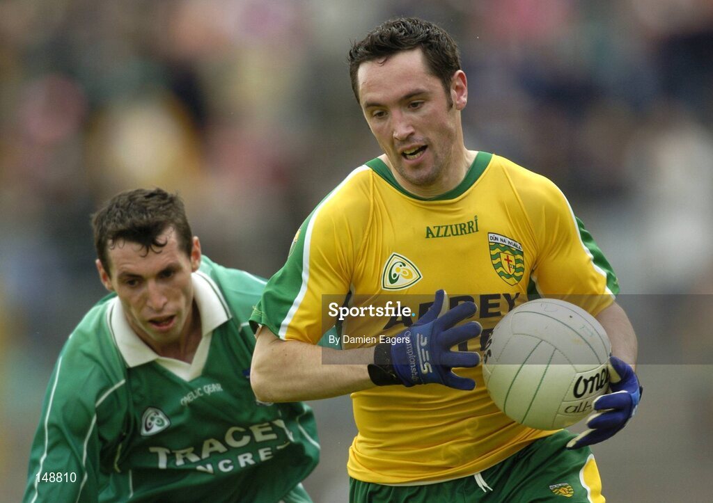 24 July 2004; Brendan Devenney, Donegal, in action against Fermanagh's Raymond Johnson. Bank of Ireland Senior Football Championship Qualifier, Round 4, Fermanagh v Donegal, Tighernach's Park, Clones. Co. Monaghan. Picture credit; Damien Eagers / SPORTSFILE