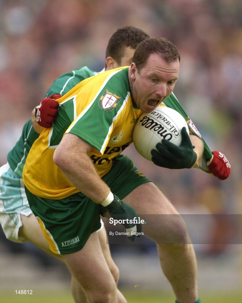 24 July 2004; Adrian Sweeney, Donegal, is tackled by Fermanagh's Barry Owens. Bank of Ireland Senior Football Championship Qualifier, Round 4, Fermanagh v Donegal, Tighernach's Park, Clones. Co. Monaghan. Picture credit; Damien Eagers / SPORTSFILE