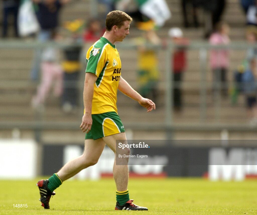 24 July 2004; Donegal's Stephen McDermott walks off the field after he was sent off. Bank of Ireland Senior Football Championship Qualifier, Round 4, Fermanagh v Donegal, Tighernach's Park, Clones. Co. Monaghan. Picture credit; Damien Eagers / SPORTSFILE
