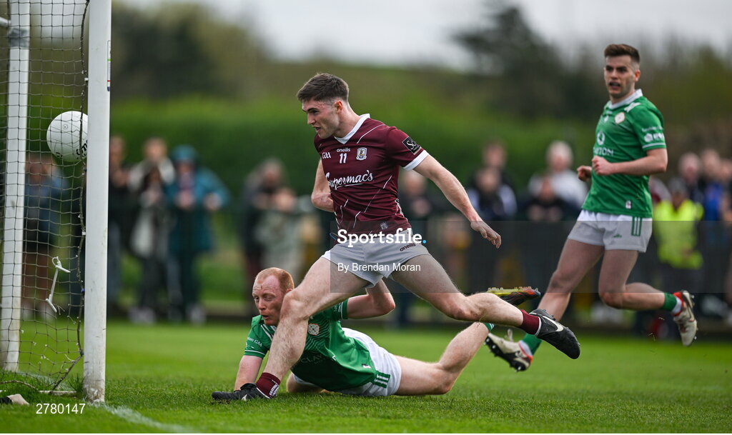 6 April 2024; Cathal Sweeney of Galway scores his side's first goal despite the efforts of Stephen Dornan of London during the Connacht GAA Football Senior Championship quarter-final match between London and Galway at McGovern Park in Ruislip, England. Photo by Brendan Moran/Sportsfile