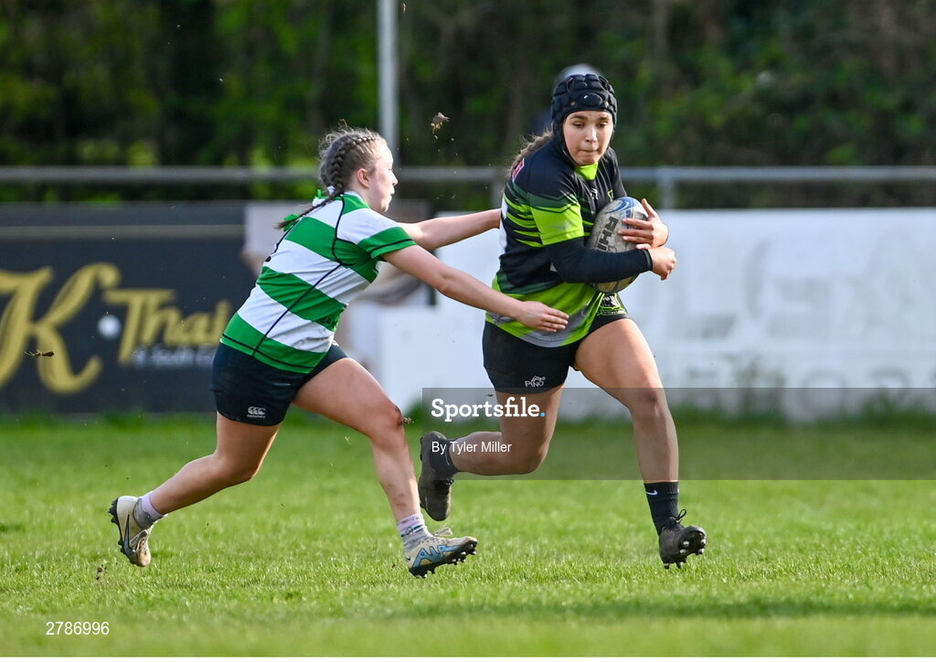 13 April 2024; Sarah Boyce Donohoe of Portdara in action against Muireann Cawley of Naas during the Leinster Rugby Girl's U18 semi-final match between Naas and Portdara at Naas RFC in Kildare. Photo by Tyler Miller/Sportsfile