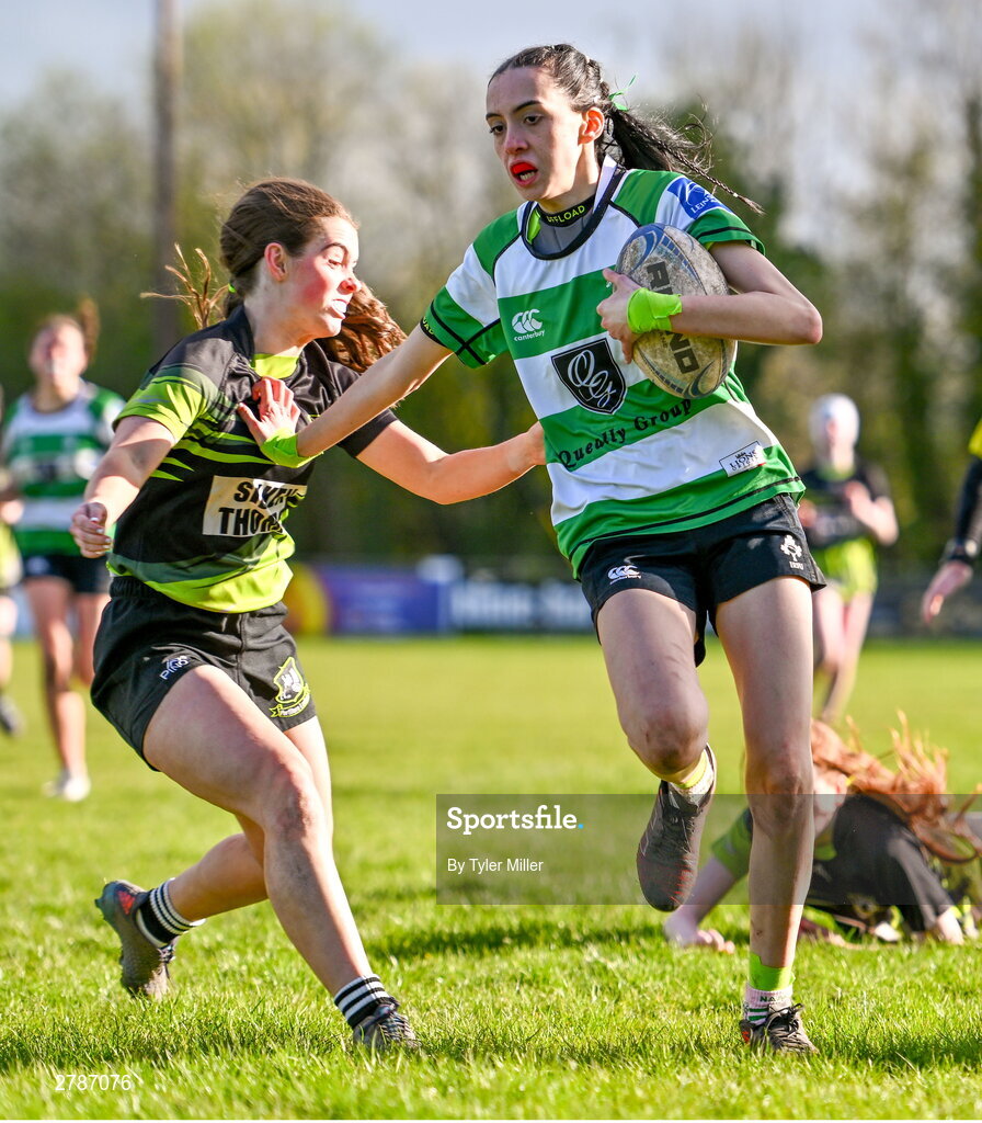 13 April 2024; Alice Boland of Naas on her way to scoring her side's first try despite the efforts of Anna Taylor of Portdara during the Leinster Rugby Girl's U18 semi-final match between Naas and Portdara at Naas RFC in Kildare. Photo by Tyler Miller/Sportsfile