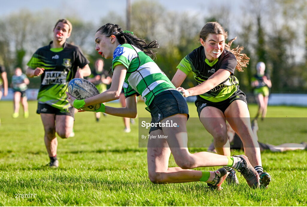 13 April 2024; Alice Boland of Naas dives over to score her side's first try despite the efforts of Anna Taylor of Portdara during the Leinster Rugby Girl's U18 semi-final match between Naas and Portdara at Naas RFC in Kildare. Photo by Tyler Miller/Sportsfile