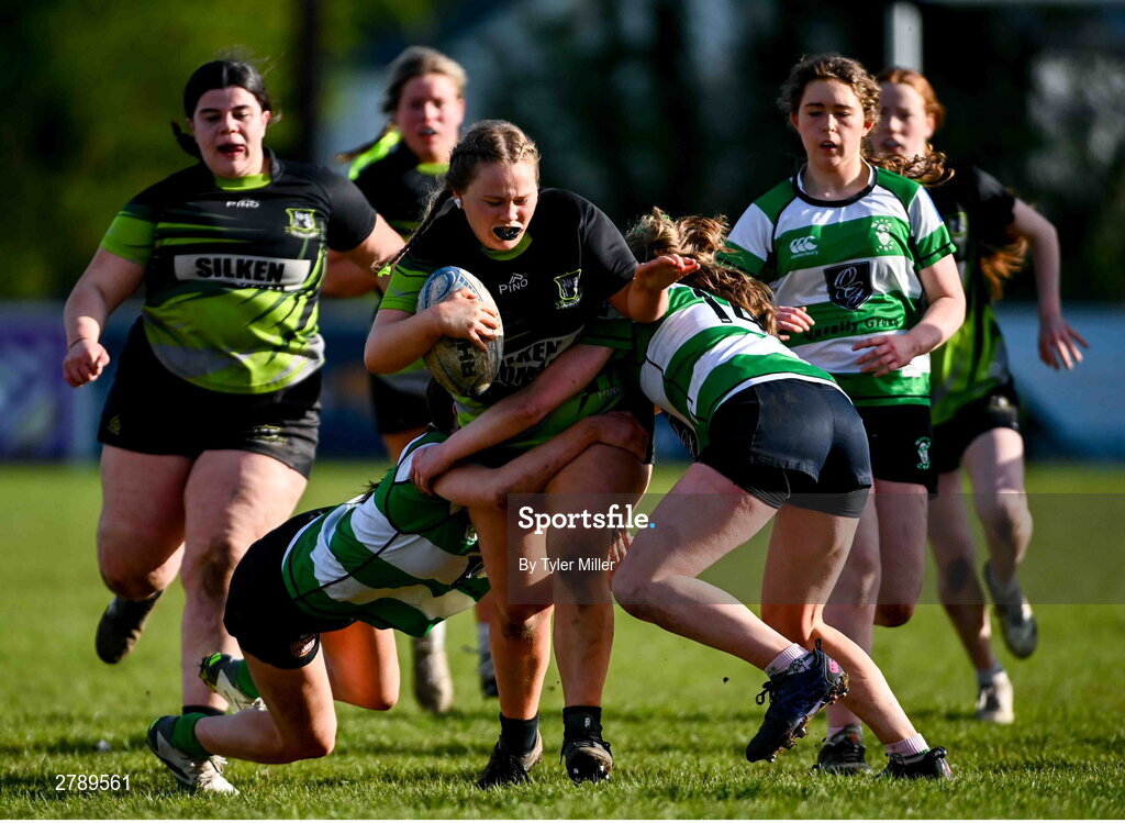 13 April 2024; Avril Whittle of Portdara is tackled by Sophie Cullen, left, and Sophie Francis of Naas during the Leinster Rugby Girl's U18 semi-final match between Naas and Portdara at Naas RFC in Kildare. Photo by Tyler Miller/Sportsfile