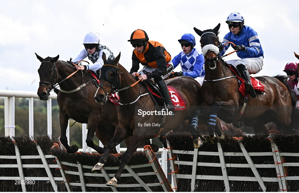 1 May 2024; Runners and riders, from left, Smooth Scotch, with Liam Quinlan up, Joyau De Thaix, with Shane O'Callaghan up, and Baltic Bird, with Oakley Brown up, jump the second during the Adare Manor Opportunity Series Final Handicap Hurdle during day two of the Punchestown Festival at Punchestown Racecourse in Kildare. Photo by Seb Daly/Sportsfile