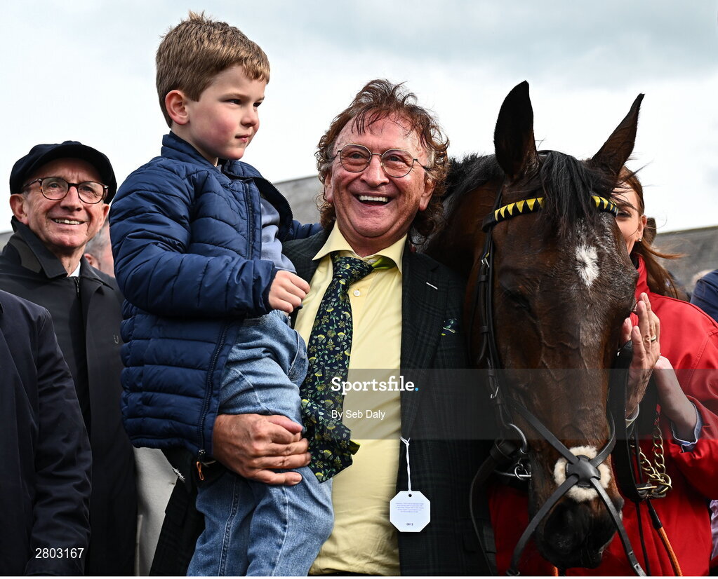 1 May 2024; Owner Sean Mulryan, with his grandson Sean, after sending out Fastorslow to win the Ladbrokes Punchestown Gold Cup during day two of the Punchestown Festival at Punchestown Racecourse in Kildare. Photo by Seb Daly/Sportsfile