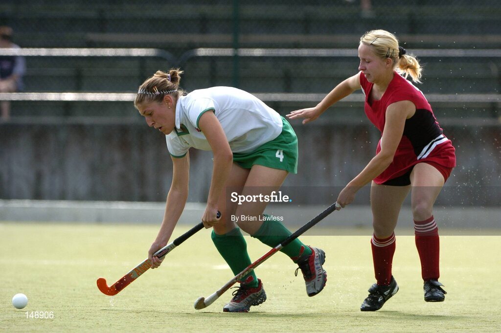 30 July 2004; Karen Hales, Ireland, in action against Natalia Varabyova, Belarus. European Hockey Junior Championship, Cross Over Match, Ireland v Belarus, UCD, Belfield, Dublin. Picture credit; Brian Lawless / SPORTSFILE