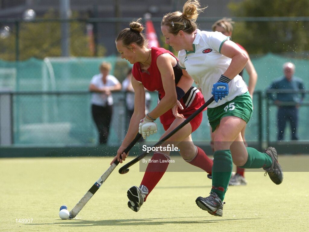 30 July 2004; Alena Yanybaeva, Belarus, in action against Sinead Connery, Ireland. European Hockey Junior Championship, Cross Over Match, Ireland v Belarus, UCD, Belfield, Dublin. Picture credit; Brian Lawless / SPORTSFILE