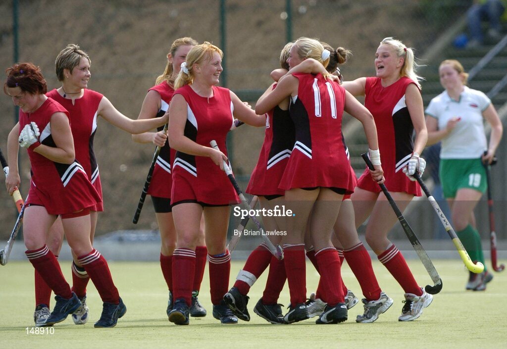 30 July 2004; Belarus players celebrate after their captain Volha Shyntar (hidden) had scored her third goal. European Hockey Junior Championship, Cross Over Match, Ireland v Belarus, UCD, Belfield, Dublin. Picture credit; Brian Lawless / SPORTSFILE