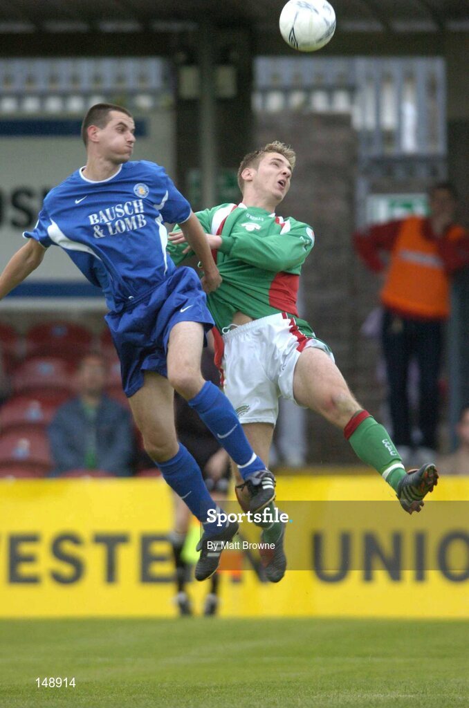 30 July 2004; Kevin Doyle, Cork City, in action against Waterford United's Alan Carey. eircom League Premier Division, Cork City v Waterford United, Turners Cross, Cork. Picture Credit; Matt Browne / SPORTSFILE