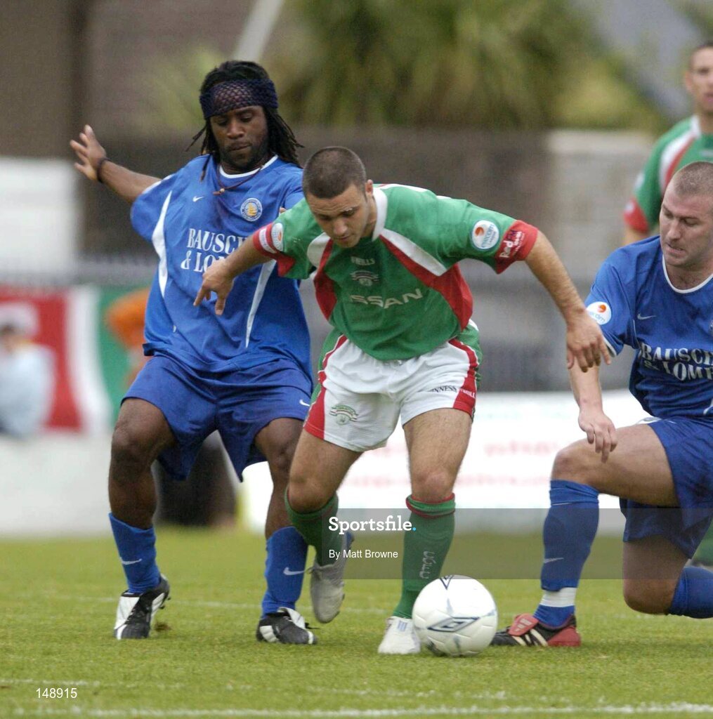 30 July 2004; Danny Murphy, Cork City, in action against Waterford United's Jose Quitongio, left, and Alan Reynolds. eircom League Premier Division, Cork City v Waterford United, Turners Cross, Cork. Picture Credit; Matt Browne / SPORTSFILE