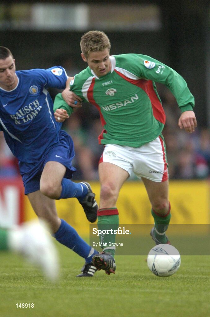 30 July 2004; Kevin Doyle, Cork city, in action against Waterford United's Alan Carey. eircom League Premier Division, Cork City v Waterford United, Turners Cross, Cork. Picture Credit; Matt Browne / SPORTSFILE