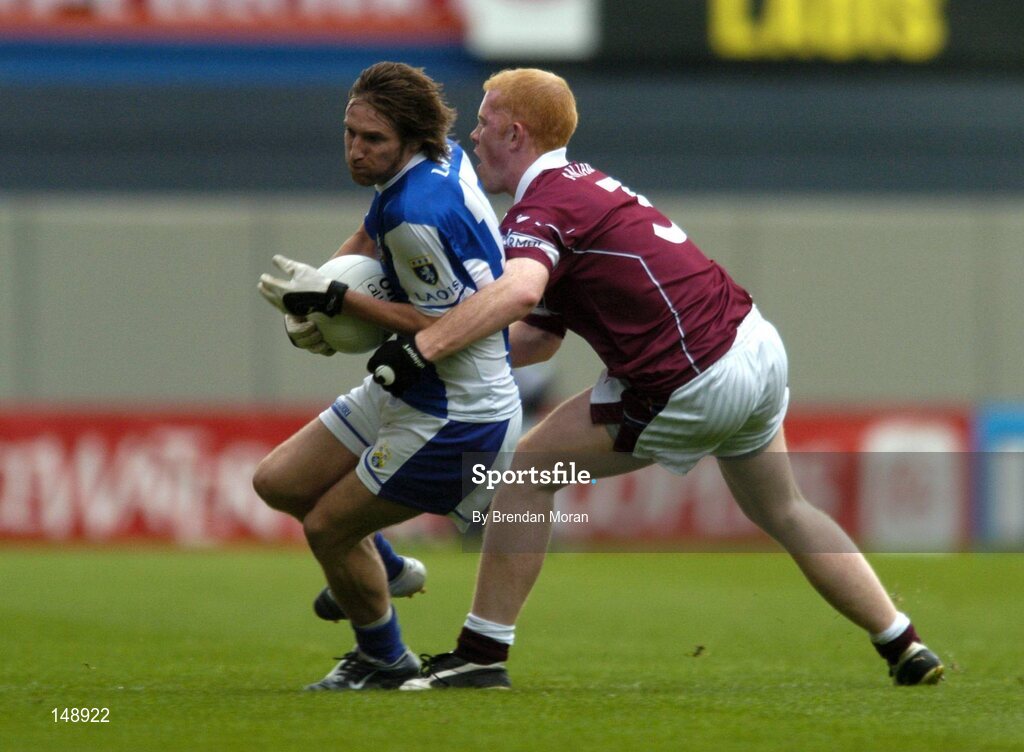24 July 2004; Colm Parkinson, Laois, in action against Donal O'Donoghue, Westmeath. Bank of Ireland Leinster Senior Football Championship Final Replay, Westmeath v Laois, Croke Park, Dublin. Picture credit; Brendan Moran / SPORTSFILE