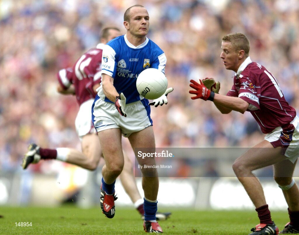 24 July 2004; Tom Kelly, Laois, in action against Denis Glennon, Westmeath. Bank of Ireland Leinster Senior Football Championship Final Replay, Westmeath v Laois, Croke Park, Dublin. Picture credit; Brendan Moran / SPORTSFILE
