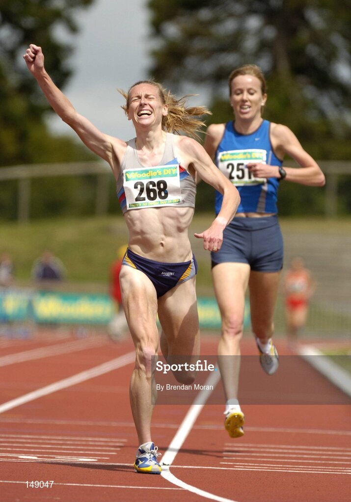 25 July 2004; Maria McCambridge, Dundrum South Dublin AC, celebrates her victory in the Women's 5000m Final ahead of second placed Una English, Dublin City Harriers AC. AAI Senior Track and Field Championships, Morton Stadium, Santry, Dublin. Picture credit; Brendan Moran / SPORTSFILE