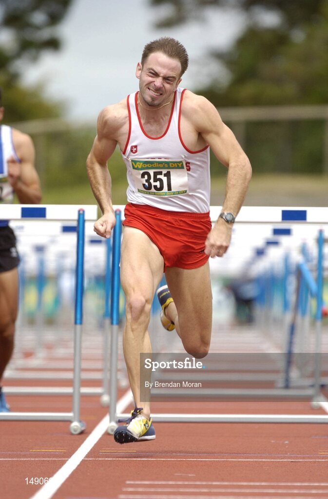 25 July 2004; Peter Coghlan, Crusaders AC, on his way to victory in the Men's 110m Hurdles Final. AAI Senior Track and Field Championships, Morton Stadium, Santry, Dublin. Picture credit; Brendan Moran / SPORTSFILE