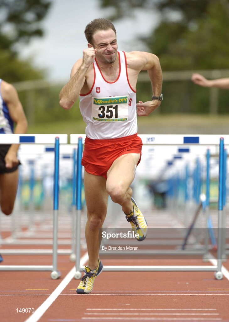 25 July 2004; Peter Coghlan, Crusaders AC, on his way to victory in the Men's 110m Hurdles Final. AAI Senior Track and Field Championships, Morton Stadium, Santry, Dublin. Picture credit; Brendan Moran / SPORTSFILE