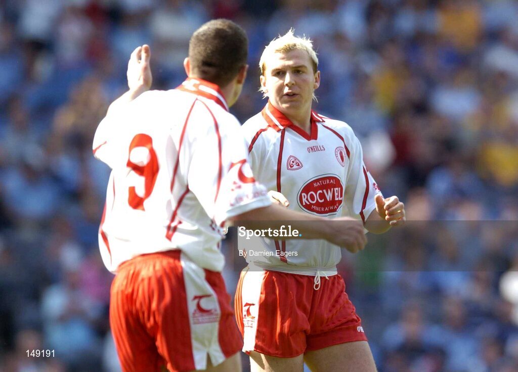 1 August 2004; Tyrone's Eoin Mulligan is congratulated by team-mate Sean Cavanagh, (9), after scoring the first goal. Bank of Ireland All-Ireland Football Championship, Round 4, Laois v Tyrone, Croke Park, Dublin. Picture credit; Damien Eagers / SPORTSFILE