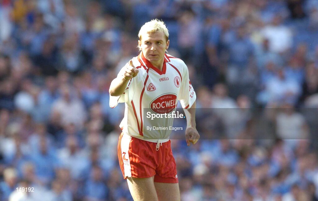 1 August 2004; Tyrone's Eoin Mulligan points to team-mate Sean Cavanagh after scoring his sides opening goal. Bank of Ireland All-Ireland Football Championship, Round 4, Laois v Tyrone, Croke Park, Dublin. Picture credit; Damien Eagers / SPORTSFILE